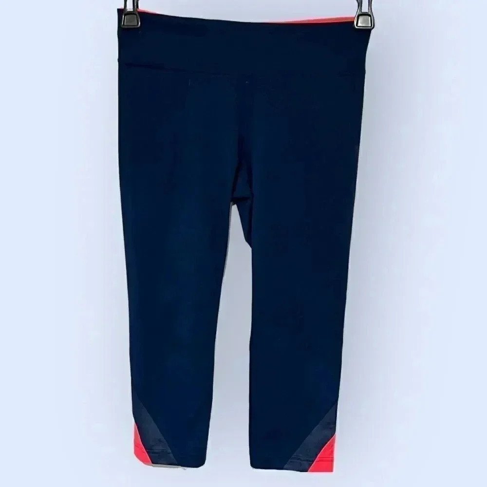 Under Armour size Small leggings, navy with coral accents, EUC